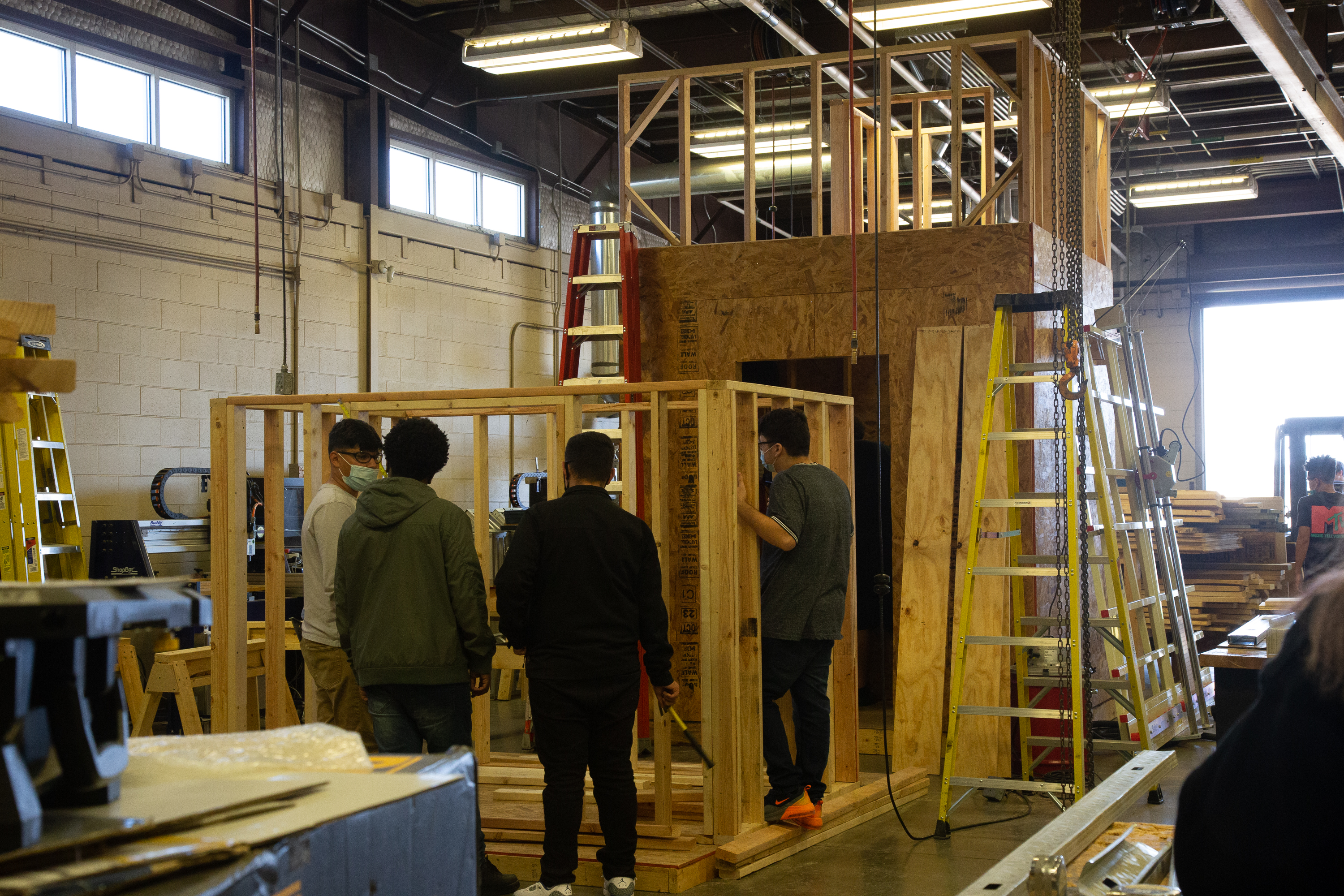 KISD Career Center students working on wood during carpentry course.